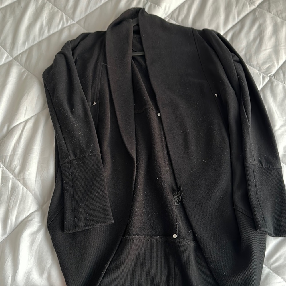 Black open cardigan worn lightly